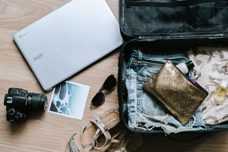 A traveler's essentials, including a passport, visa documents, and a boarding pass, prepared for a trip to Bali.