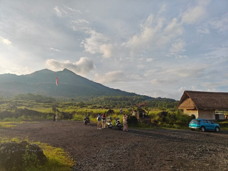 The serene Lake Batur surrounded by green hills in Bangli.