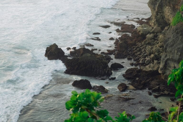 Uluwatu Temple perched on a cliff at sunset in Pecatu, Bali.