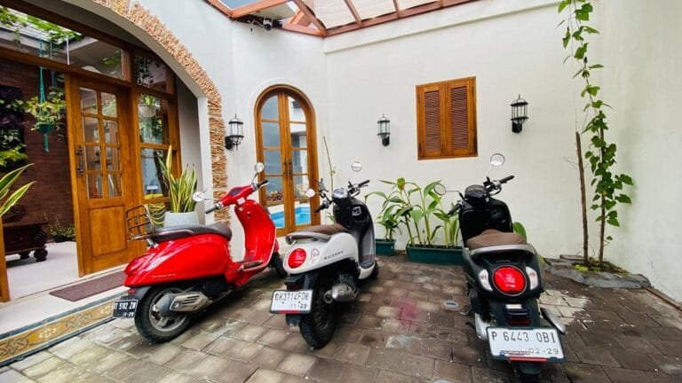 Tourist riding a scooter on a Bali road in 2025