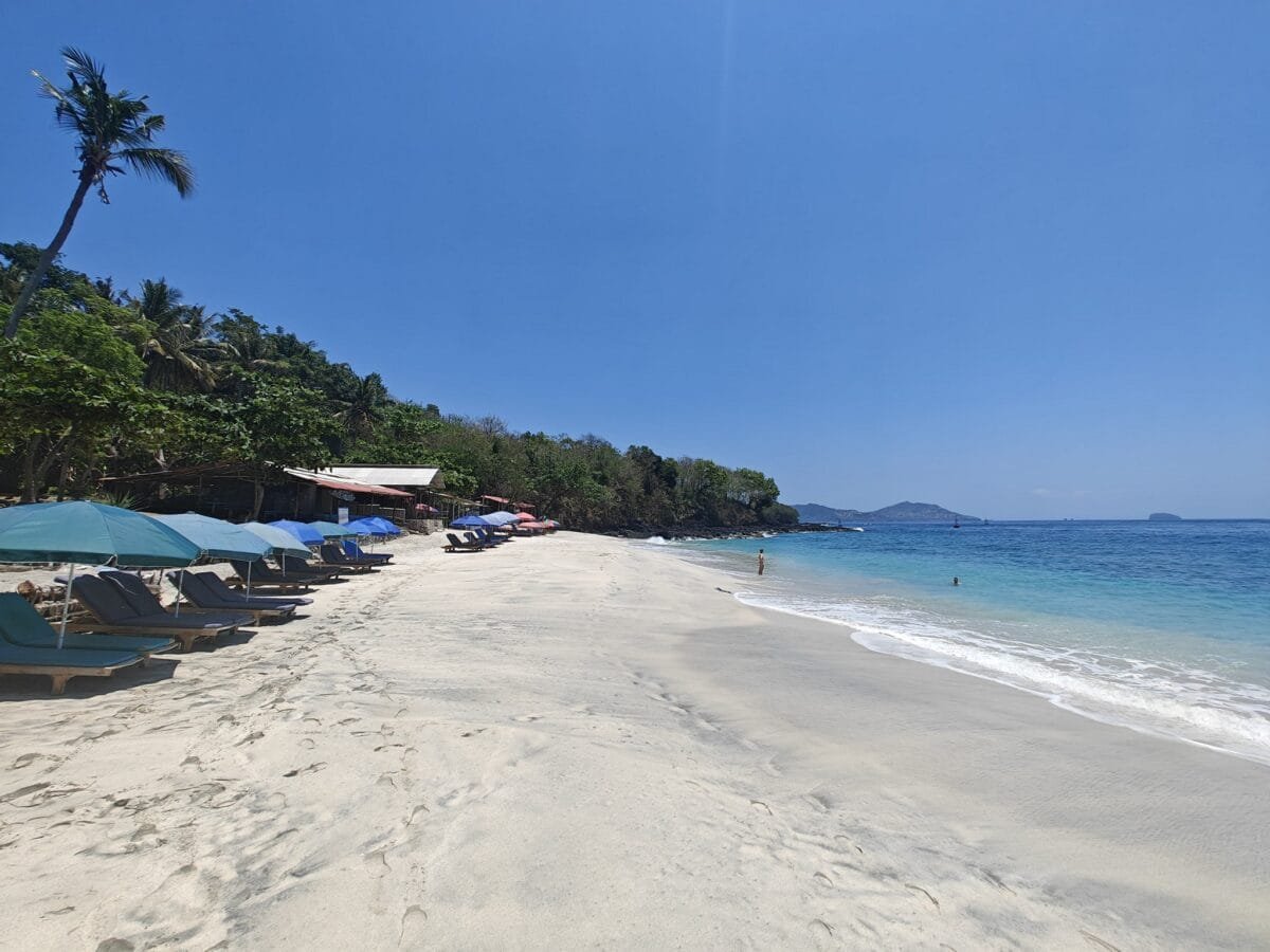 Snorkeler exploring coral reef at Bias Tugel Beach in Bali