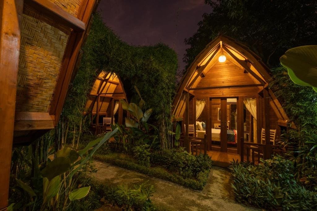 Kubu Kak Dudung Villas in Bali surrounded by tropical greenery
