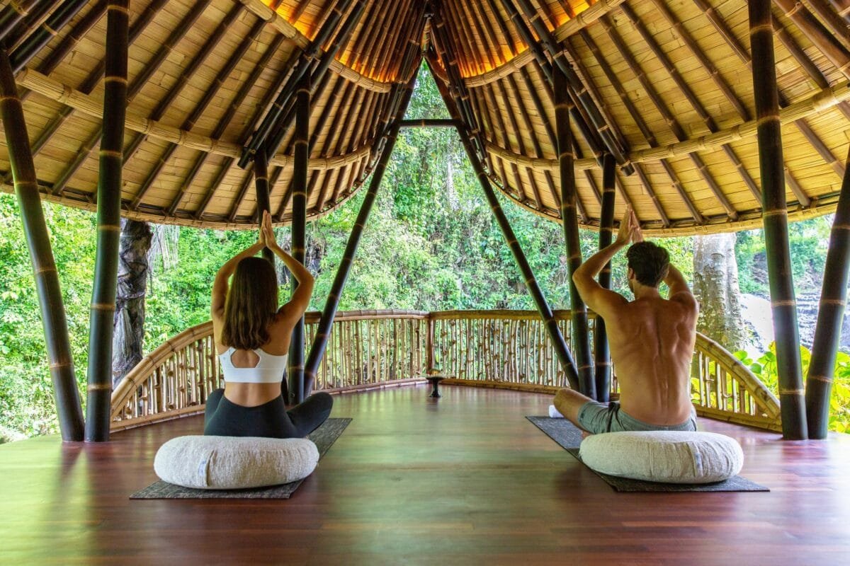 open air yoga shala in the jungle of bali surrounded by tropical nature